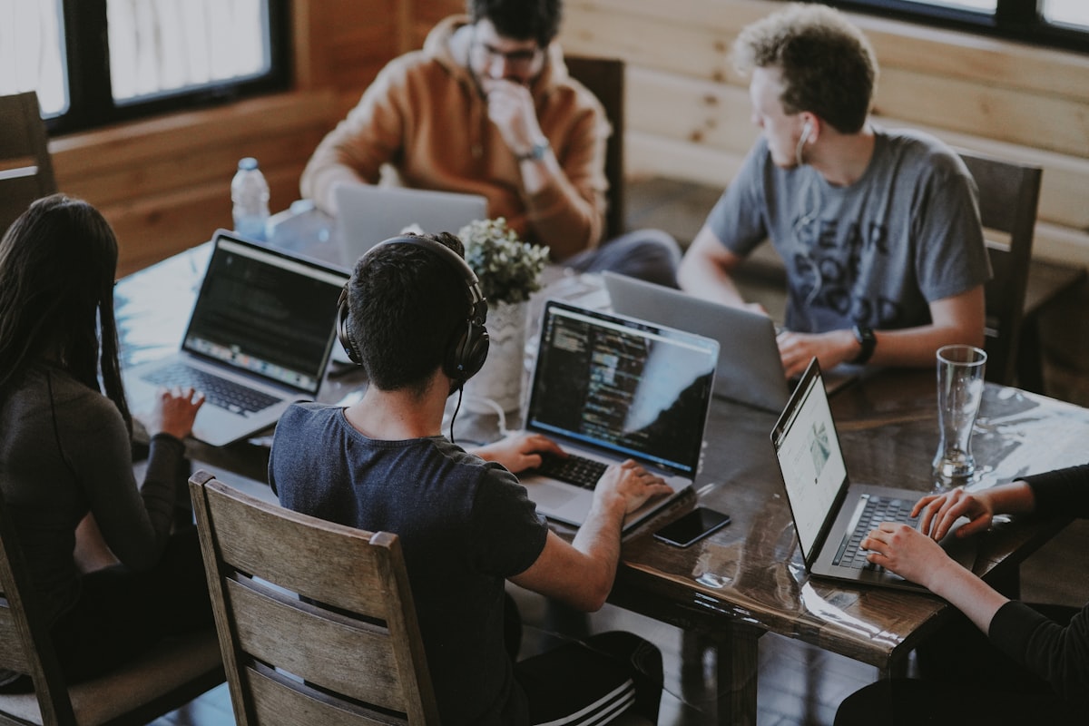 Team collaborating on digital products at The Jeez LLC