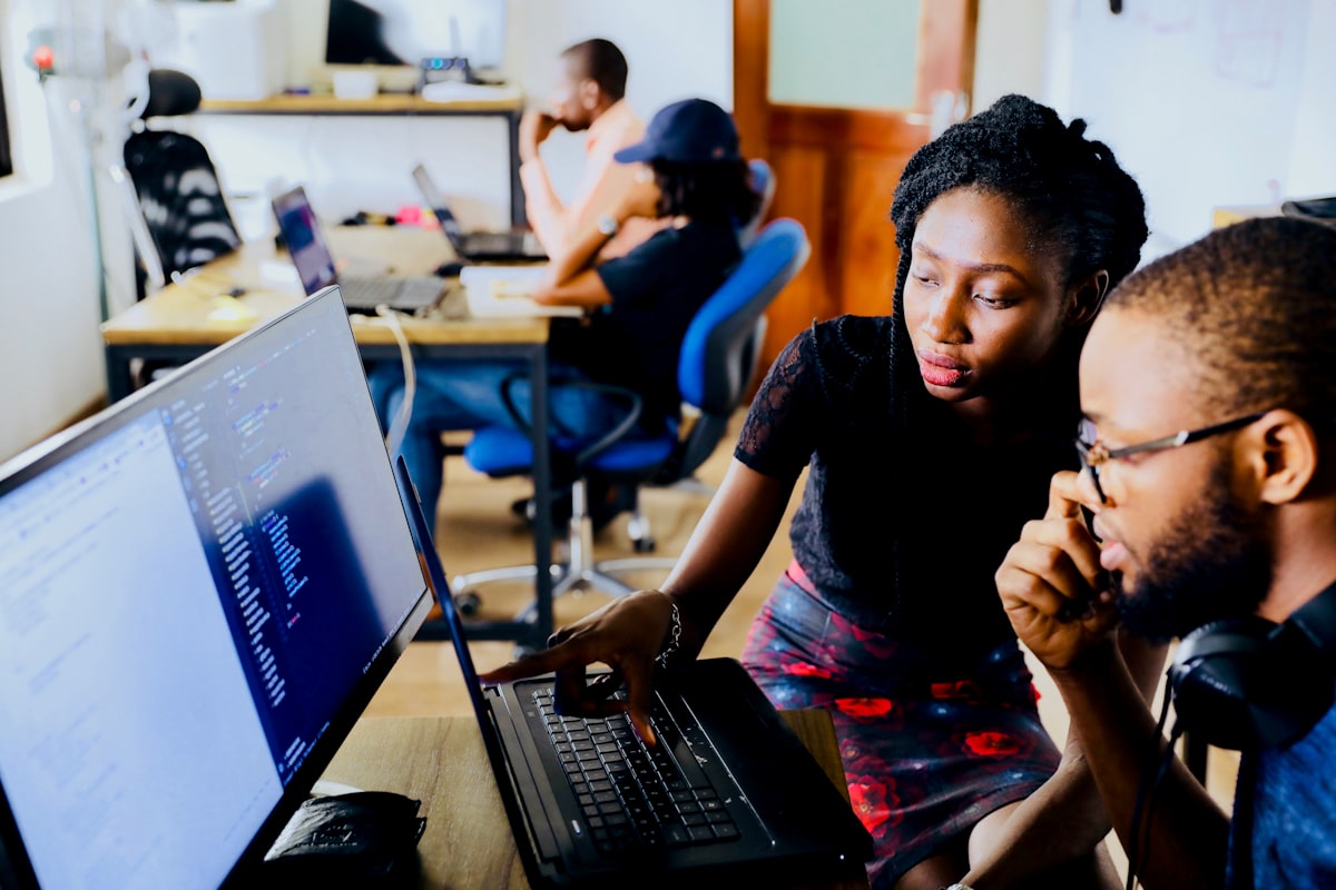 IT professionals working in a modern tech workspace